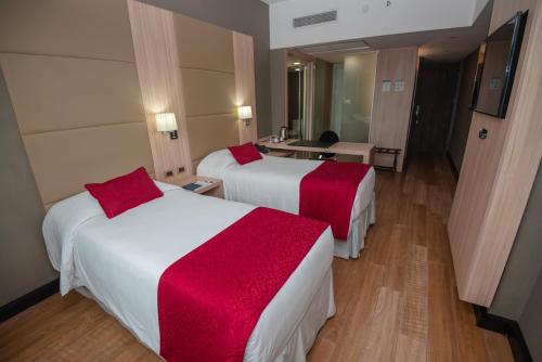 Katil atau katil-katil dalam bilik di Savoy Hotel Encarnación