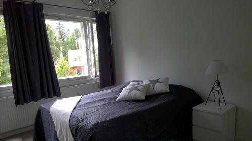 Vuode tai vuoteita majoituspaikassa City Apartment Snellmaninkatu 22 A