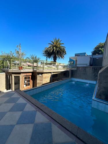 a swimming pool on top of a building at Hotel Boutique & Spa Puerto Natura in Valparaíso