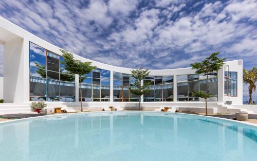 a large swimming pool in front of a building at iSea by the sea in Ninh Van Bay