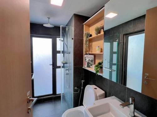 a bathroom with a sink and a shower and a toilet at Comfy & Cozy Suites 3PX @ Colony, Near Monorail & Quill City Mall in Kuala Lumpur