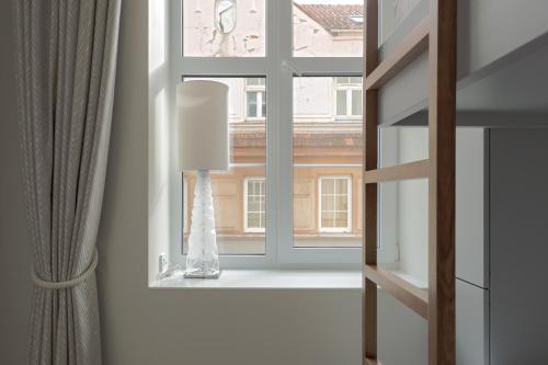 a window with a view of a building at Comfort Stay - Old Town in Klaipėda