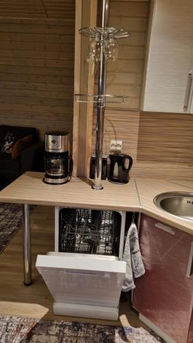 a kitchen with a counter with a coffee maker on it at Sydalen house in Kleppstad