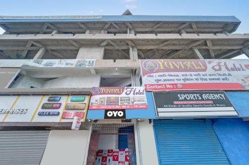 a store with signs on the side of a building at OYO Flagship YUVRAJ Hotel in Patna