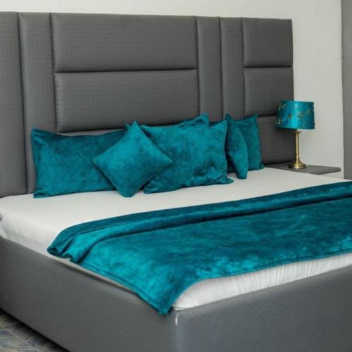 Ένα ή περισσότερα κρεβάτια σε δωμάτιο στο Perriman Hotel