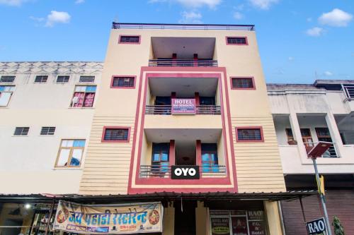 a tall white building with a sign on it at OYO Hotel Rao Residency in Jaipur