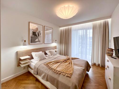 Ένα ή περισσότερα κρεβάτια σε δωμάτιο στο Apartament ODNOWA M29 basen i jacuzzi