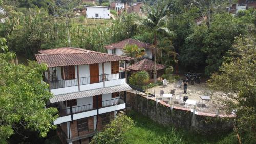 an aerial view of a house in a village at Xplora Hostel in Caldas