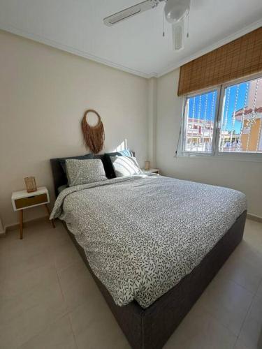 a bedroom with a large bed in a room at Casa Miro in Ciudad Quesada