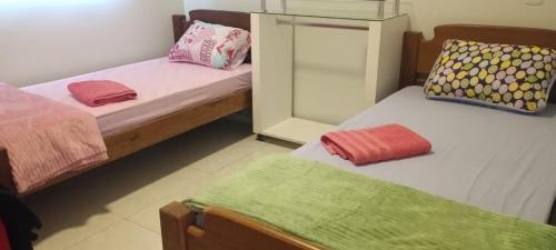 Voodi või voodid majutusasutuse Casa de Temporada Bonito-MS toas