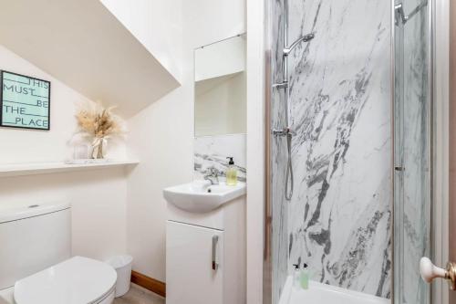 a bathroom with a shower and a toilet and a sink at Crail Town House - Sleeps 6 in Crail