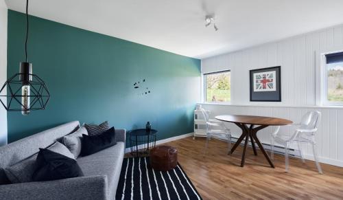 a living room with a couch and a table at Beatnik Hotel in Bromont