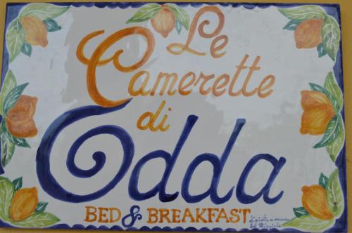 un pastel que dice lecho de atado y desayuno en Le Camerette di Edda, en Cassino