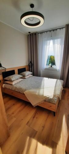 Posteľ alebo postele v izbe v ubytovaní Asti Apartamenty Centrum Stargard