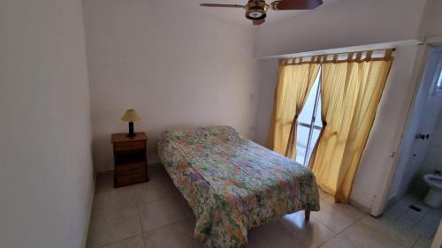 A bed or beds in a room at Departamentos calle 8