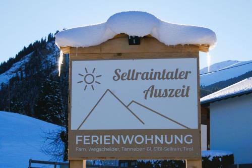 a sign with snow on top of it at Sellraintaler Auszeit 1 in Sellrain