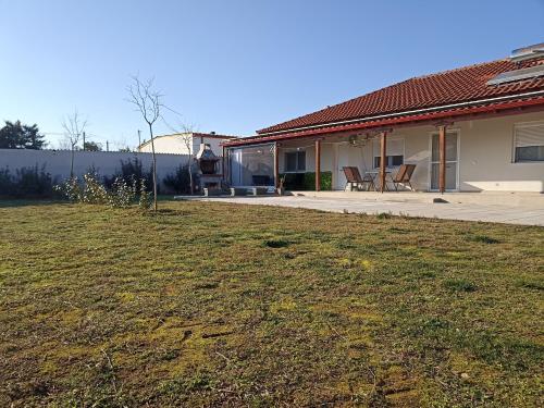 a house with a lawn in front of it at Kilkis Paradise in Kilkís