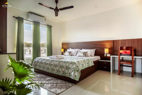 Ένα ή περισσότερα κρεβάτια σε δωμάτιο στο Borail Homes