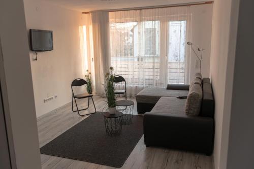 a living room with a couch and a table at Ferienwohnung in Kassel