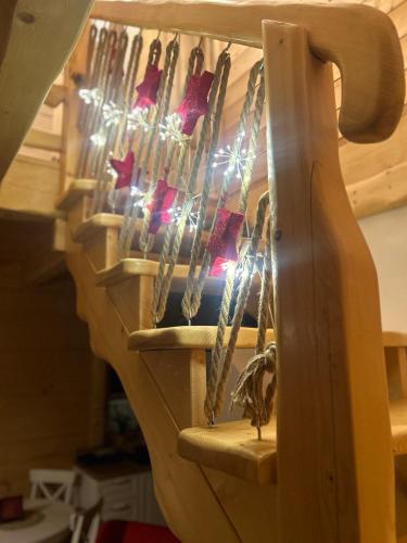 a wooden staircase with a bunch at Słoneczna Chata z Bali in Lądek-Zdrój