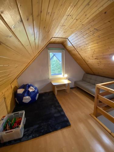 Postel nebo postele na pokoji v ubytování Beskidzka Apartments