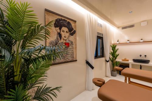 a living room with a painting on the wall at Ftelia Black Villas in Elia