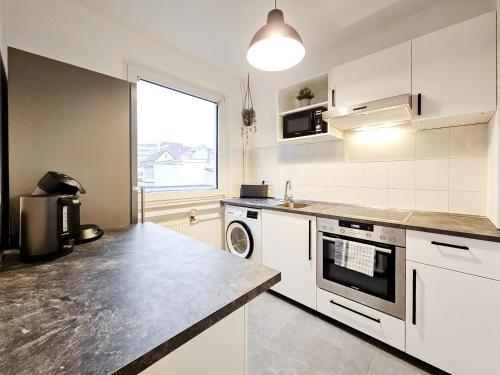 Virtuvė arba virtuvėlė apgyvendinimo įstaigoje Centerline Apartments Solingen