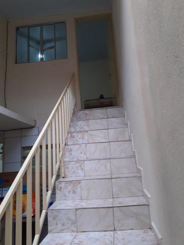 a stairway leading up to a building at Espaço igor in Aparecida