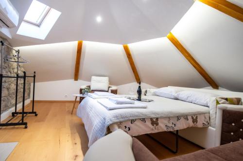 a room with two beds and a table at Kula Centar in Trebinje