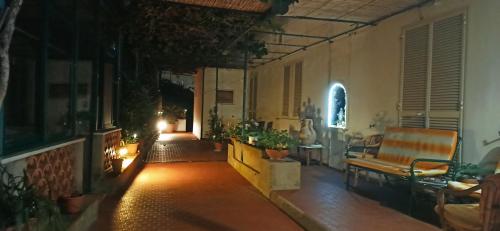 a room with a porch with a couch and some plants at Villa dei fiori B&B in Capri