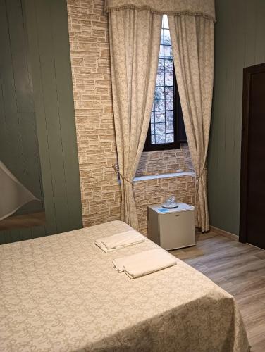 מיטה או מיטות בחדר ב-Corso18