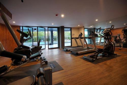 a gym with a bunch of exercise bikes in it at Seamira House Huahin in Hua Hin