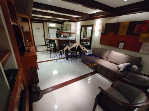 a living room with a couch and a table at Laje de Pedra Mountain VillagePrime in Canela