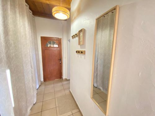 a bathroom with a shower and a mirror on the wall at Esprit Bohème in Fayence