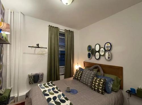 a bedroom with a bed with pillows and a window at Fab 3 Bedroom 1Bath Apartment in NYC! in New York