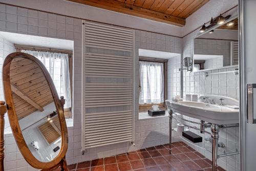 a bathroom with a sink and a mirror at Chalet BRAGARD in Limone Piemonte