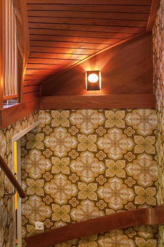 a room with a wooden ceiling with a light on it at Villa Berkle in Stockholm