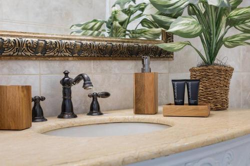 a bathroom sink with a faucet on a counter at Newly renovated 3 bedrooms near the beach and res1 in Pompano Beach