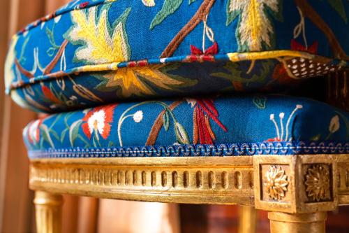 a close up of a chair with blue and gold at Thorngrove Manor in Stirling