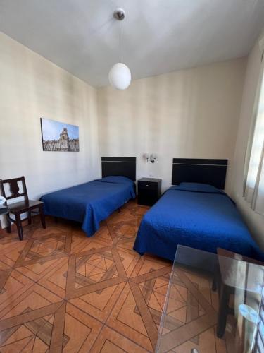 Letto o letti in una camera di Hotel Tito