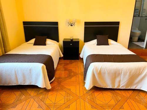Letto o letti in una camera di Hotel Tito