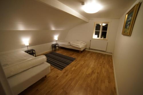 a living room with a couch and a window at House close to the Sea in Sundsvall