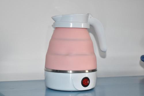 a pink and white blender on a counter at Pineapple House in Nungwi