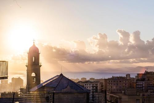 a view of a city with a clock tower at Castelletto - Appartamento+P. Auto : La Funicolare in Genova