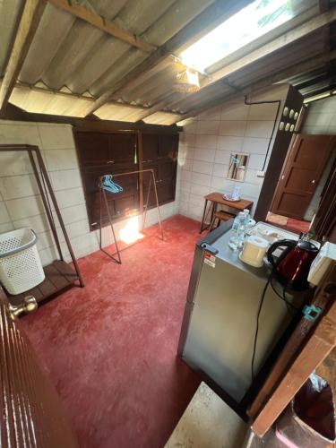 an overhead view of a kitchen with red carpet at Phayam Valley Homestay in Ko Phayam
