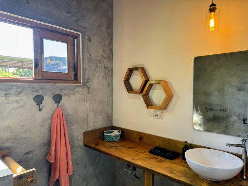 a bathroom with a sink and a mirror at Casa Salvaje Vacation Rentals in Bocas del Toro