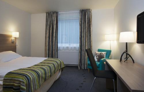 Кровать или кровати в номере Thon Hotel Bjørneparken