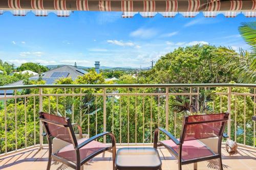 two chairs on a balcony with a view at Bright & Breezy ~ 2 Bed/2 Bath /1 Car/ Views! in Brisbane