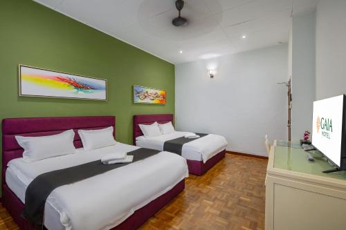 Postel nebo postele na pokoji v ubytování GAIA Hotel