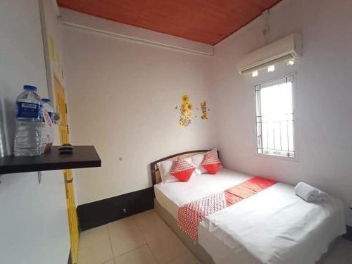 Ένα ή περισσότερα κρεβάτια σε δωμάτιο στο EMWEKA Guest House